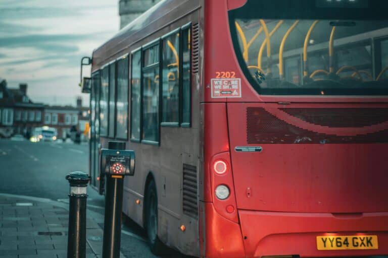 The back of a double-decker bus in the concept of 'top services and amenities in East London'.